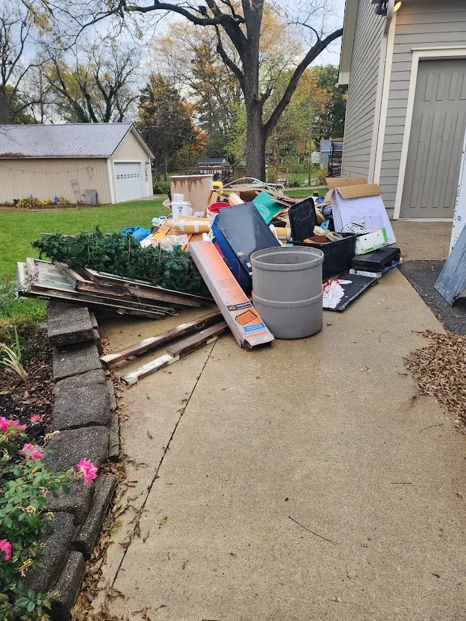 Dumpster being loaded with debris for Residential Dumpster Rental in Fort Lupton